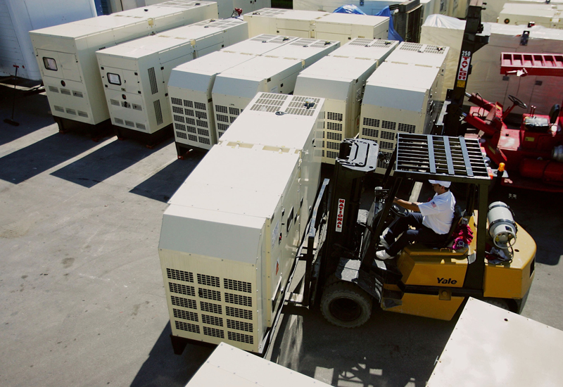 MIAMI - MAY 18:  Joe Aceveda moves industrial size electrical generators by fork lift at Americas Generators May 18, 2006 in Miami, Florida. The generator company which sells generators for home as well as large business has seen a spike in sales in the run up to the beginning of hurricane season on June 1.  (Photo by Joe Raedle/Getty Images)